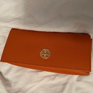 Orange Tory Burch sunglasses holder